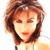 Pixelated close-up of a person with light brown hair styled in a voluminous, layered cut, wearing a white top against a plain background.