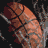 Pixelated basketball with brown and orange tones on dark background, showing partial ball shape with visible seams.