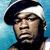 Pixelated static image of a person wearing a dark cap with white trim against a blue background, rendered in low-resolution style typical of early 2000s instant messaging icons.