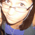 Pixelated close-up of a person with light skin tone wearing dark brown hair and blue clothing, face partially obscured by pixelation.