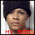 A person wearing a dark knit beanie and orange shirt appears in six with changing text colors beneath the head