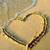 Animated heart-shaped icon with a golden-brown border and light beige interior, set against a textured background.