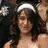 A four- of pixelated images showing a person with long dark hair in various poses and expressions, alongside a pink floral design with white text