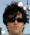 A person with dark tousled hair and sunglasses appears in a static image with heart symbols changing position across frames.