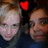 Two pixelated faces with a red heart symbol above them on a dark background.