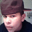 A pixelated image shows a person wearing a brown cap and dark clothing, with cyan text reading "I Don't Care, so... YAH TZEE!! To You" on a black background.