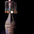 A pixelated vertical icon shows a hand holding a small object with colorful details against black background.