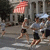 A pixelated street scene with people walking under a red awning, alongside text reading "Media Five Miler" and date "6/20/2008" in red digital font.