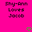 Pixelated text on bright pink background with two green heart icons at bottom, displaying 'Shy-Ann Loves Jacob' in black block letters.