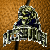 Pixelated icon of a character in dark armor with greenish face and blue chest plate against brown background.