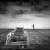 Black-and-white animated sequence showing a of identical vehicles with text changing across frames, each frame displaying different words in white pixelated font