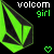 Two side-by-side pixelated images of a green and black geometric shape with 'volcom girl' text, one showing a green heart icon below it.