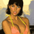 Pixelated static image of a woman in a bikini top with yellow straps, dark hair, and visible facial features against a blurred background.