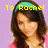 Pixelated image of a person with long brown hair wearing a teal headband, yellow text reading 'To Rachel' above the head, and a light purple background.