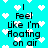 Pixelated cyan background with white heart shapes and repeated text "I Feel like I'm Floating on air" in black block letters.