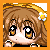 Pixelated anime-style face with brown hair, large black eyes with white pupils, and a small flower accessory on the right side of the head.