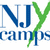 Pixelated logo with blue and green text reading 'NXY Camps' on white background, featuring a stylized green leaf-like shape intersecting the letters.