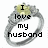 A silver ring with a yellow gemstone displays text that changes from 'I love my husband' to '<3'.