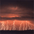 A static pixelated image showing a gradient of warm orange and brown tones transitioning from dark at the top to bright at the bottom, with horizontal bands of color and no distinct subjects or text.