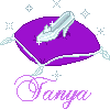 Purple cushion with white trim holds a silver high-heeled shoe, surrounded by small star-like sparkles on gray background; 'Tanya' in purple cursive below.