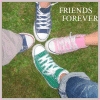 Four pairs of sneakers arranged in a circle on grass with text reading FRIENDS FOREVER in the top right corner.