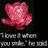 A pink flower icon with text below reading 'I love it when you smile,' a white abstract shape on dark blue background, and two silver spoons on gray surface.