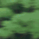 Animated sequence of a character with dark blue hair and a black outfit running through a green forest background.