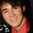 A static image with an orange background, featuring a pixelated photo of a person in a red shirt on the left and pink text reading "I LOVE KEVIN" on the right.