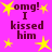 Pixelated text "omg! I kissed him" on bright pink background with yellow stars, static image.