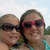 Two people wearing sunglasses pose together outdoors with a bright sky background, next to yellow and red text reading "Happy Summer 2008".
