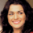 Pixelated static image of a person with long dark hair and light skin tone smiling, displayed as a 48x48 buddy icon on a neutral background.
