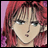 A 48x48 pixel buddy icon featuring a close-up of an anime-style character with red hair and green eyes on the left, paired with stylized text reading "Anime IM" and "com" on a black background to the right.