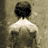 A 3x2 contact sheet of a sepia-toned animated sequence showing the back view of a shirtless person walking away from the viewer through a dimly lit corridor, with text overlay reading "LOST AND FOUND IN STORES NOW" and a stylized signature on black background.