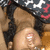 A person with dark hair and light skin wears a patterned top, lying down in two distinct poses.