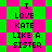 Pixelated text reads "I LOVE KATE LIKE A SISTER" on a green and pink checkered background with diamond-shaped pattern variations.