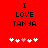 Red background with black text "I LOVE TANYA" and five pixelated hearts below, where the third heart is pink instead of white.