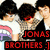 Two pixelated figures with dark hair, one in white shirt and the other in black tank top, standing side-by-side with red text reading "JONAS BROTHERS 1" below them.