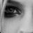 A highly pixelated grayscale icon with indistinct shapes and low-contrast areas, appearing to be a static image of an abstract or obscured subject against a light background.