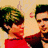 Pixelated anime-style character with green hair and red top, transitioning to a group of four figures in dark clothing against light background.