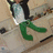 A pixelated character in green pants and a white shirt with black sleeves stands on a textured ground, with text reading "I Believe I Can FLY!!" overlaid.