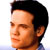 Static 50x50 pixel buddy icon showing a close-up profile of a person with short dark hair against a white background, rendered in low-resolution pixel art style.