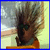 Pixelated figure with spiky hair and dark sunglasses in orange top, next to large black 'YO' text on white background.