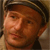 Static 50x50 pixel icon showing a close-up of a person's face with brown hair and a dark cap, rendered in low-resolution pixel art style.