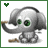 Pixelated gray elephant with green eyes holds a brown stick, standing on white background with green border and small green heart in top-left corner.