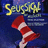 A static four- with pixelated text and imagery: top-left shows a red-and-white striped sock, top-right displays yellow text on blue background, bottom-left repeats 'SCHMITZ' in yellow, bottom-right is empty gray