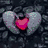 A static icon with a heart-shaped cutout revealing a red interior against a dark, textured background.