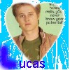 A static icon shows a person with light brown hair wearing a green shirt and brown jacket, set against a blue background with pixelated effects and text elements.