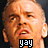 Pixelated close-up of a bald man's face with light skin, showing an open mouth and squinted eyes against a dark background.