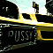 Yellow taxi cabs with black license plates displaying 'PUSSY' and 'CAT' text in various angles and positions against urban backgrounds.