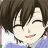 Pixelated anime-style character with brown hair, closed eyes, and a slight smile, wearing a light blue garment.
